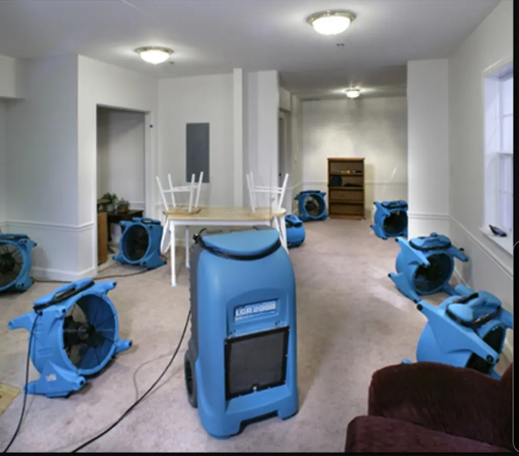 Air movers and dehumidifier setup for Water Damage Restoration in Stowe